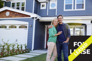 couple standing in front of their new rental property